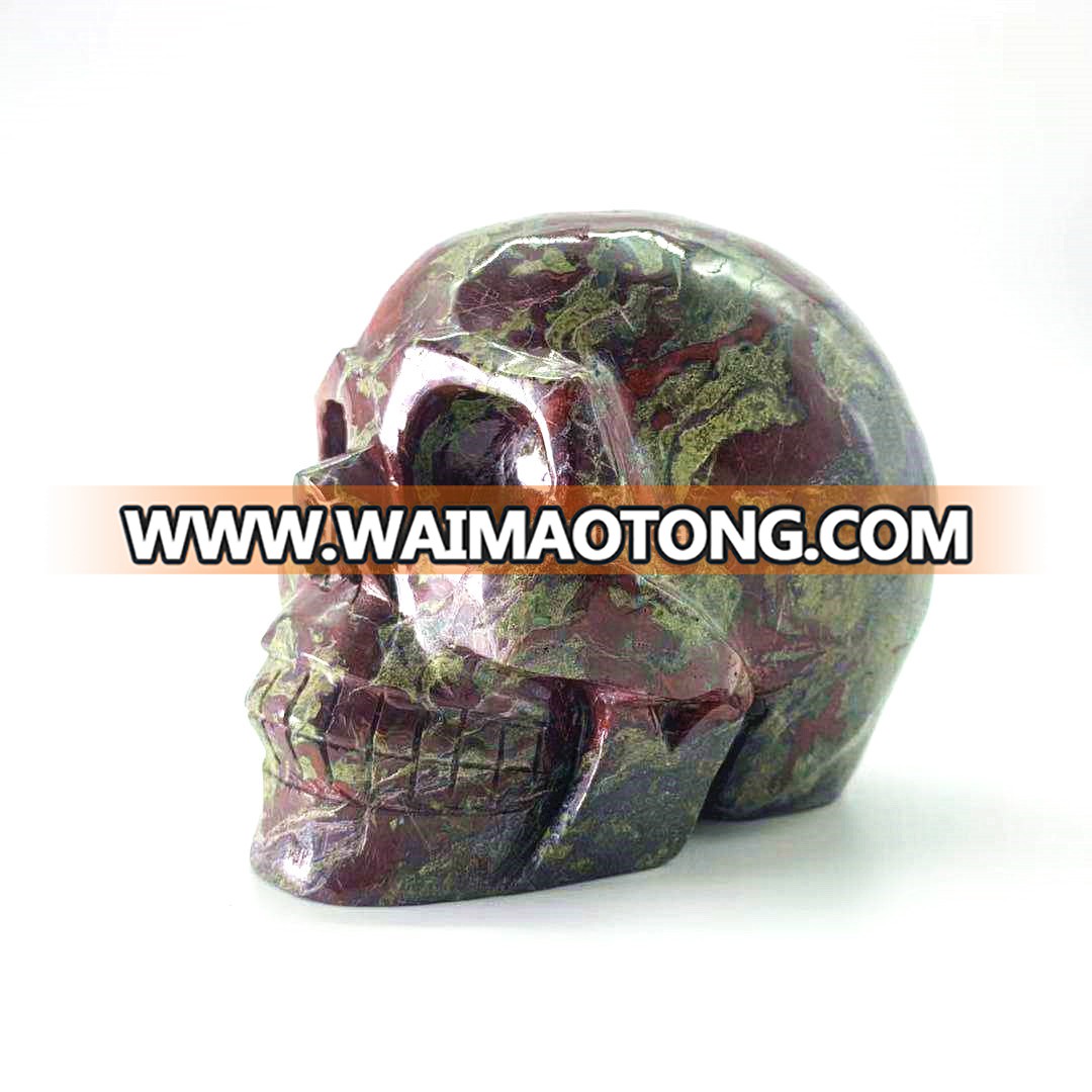 Wholesale natural hand carved crystal dragon blood stone skulls crystal craft skull for decoration