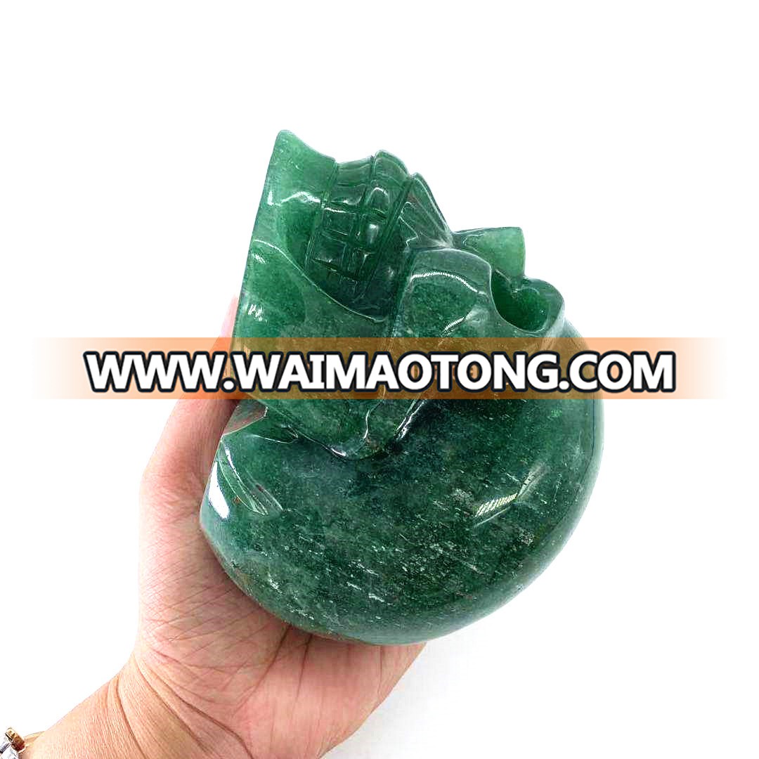 Wholesale natural hand carved crystal green strawberry stone skulls crystal craft skull for decoration