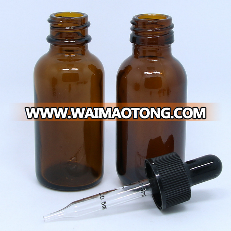 Amber glass round bottle with plastic black cap