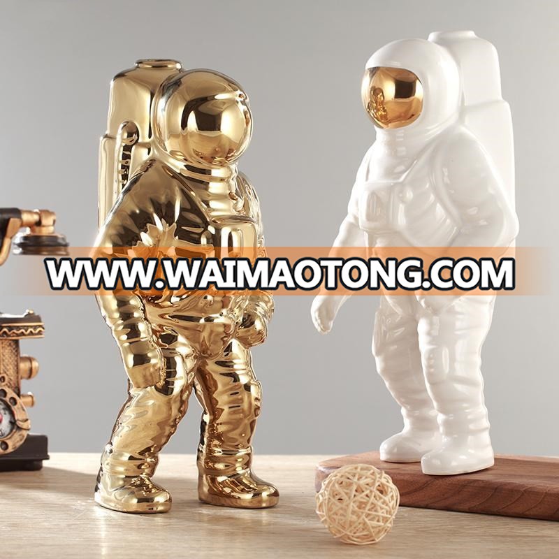 silver and gold plated astronaut model for office table design photos