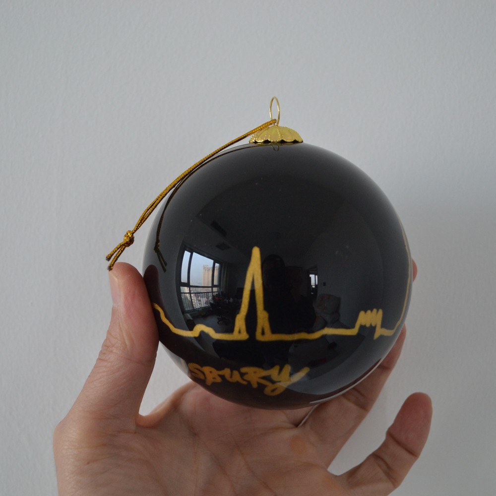 inside painting glass Christmas bauble for Christmas tree