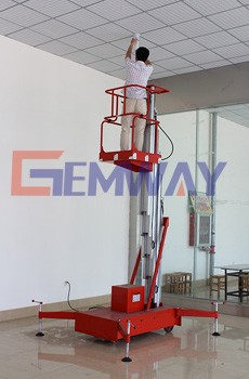 One man operating battery powered self-propelled scissor lift