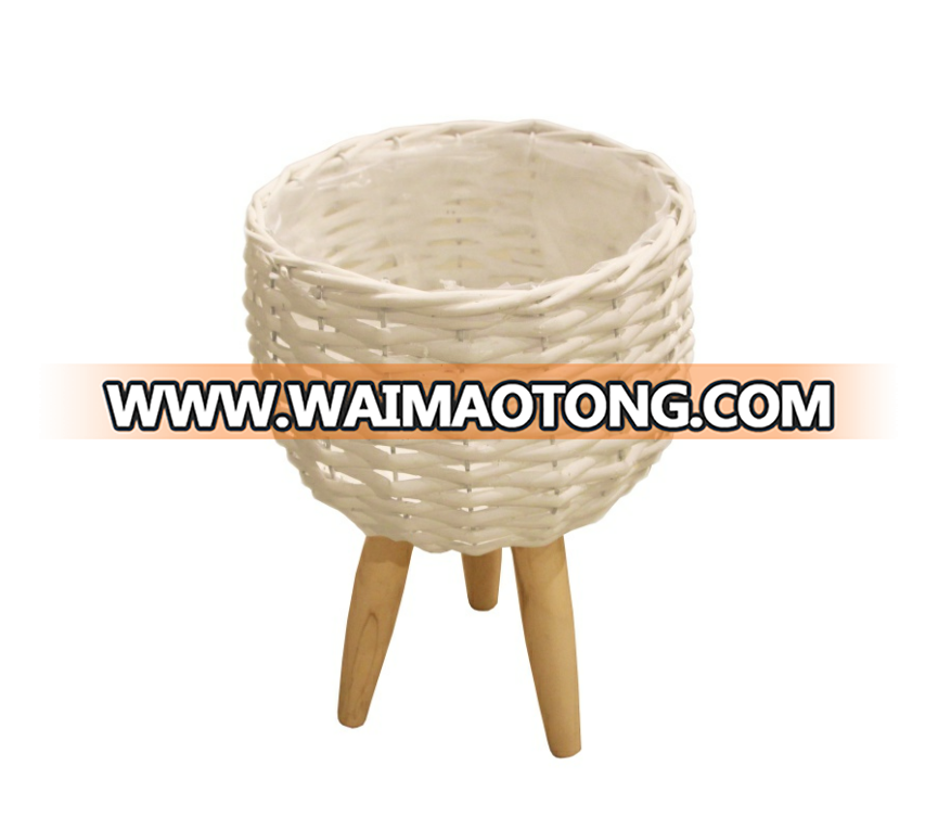 white willow planting pot with wooden feet for green plant