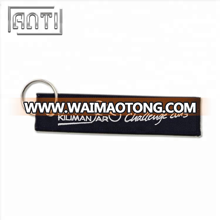 custom black coloring eyelet overlock embroidery jacquard woven keychain