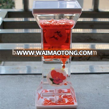 Factory price novelty crafts flowing colored liquid hour glass