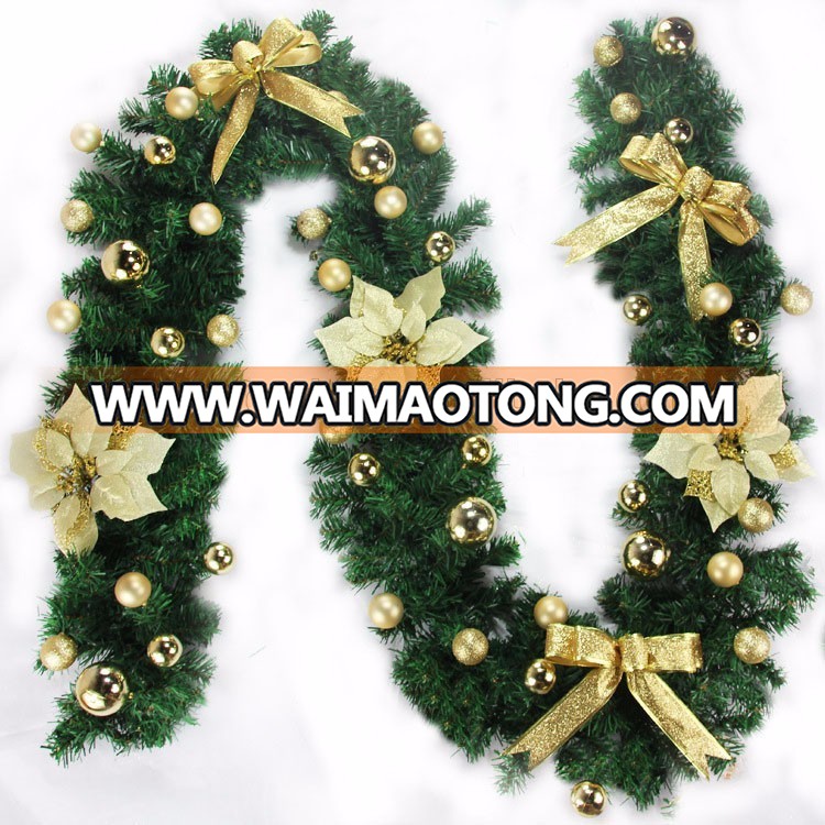 Factory artificial christmas garland with flowers and balls decorated