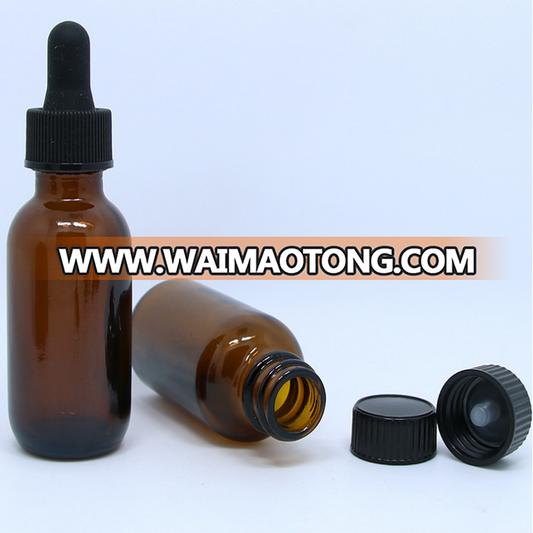 Amber glass round bottle with plastic black cap