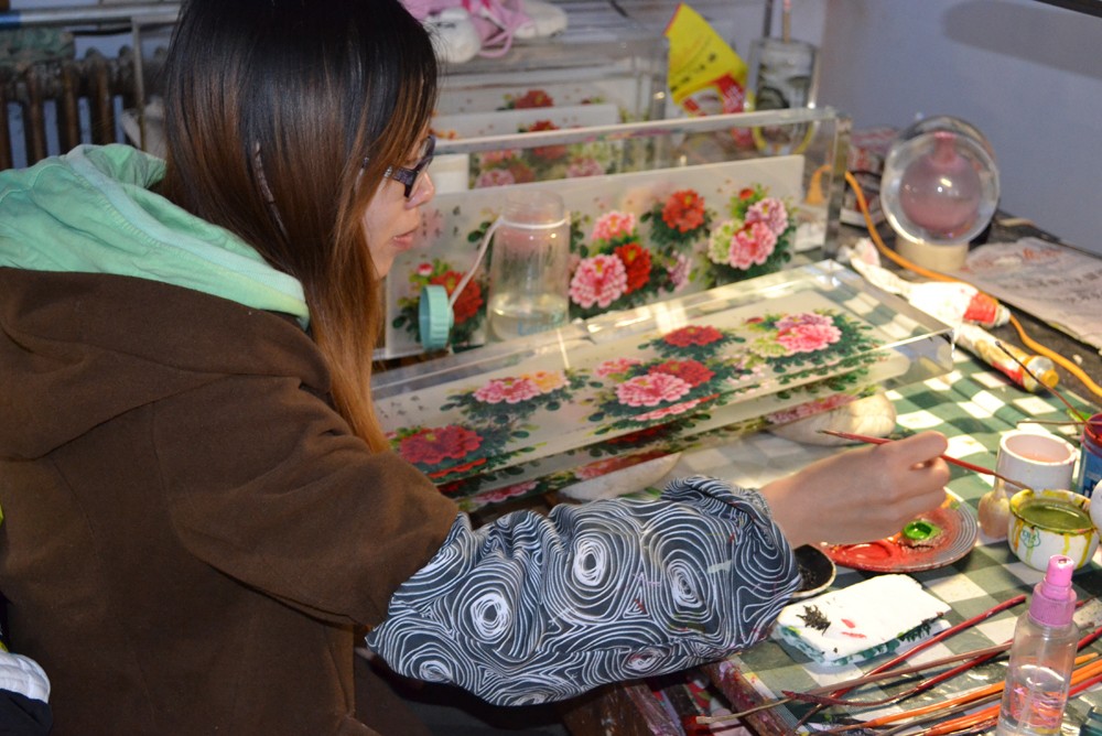 inside painting glass Christmas bauble for Christmas tree