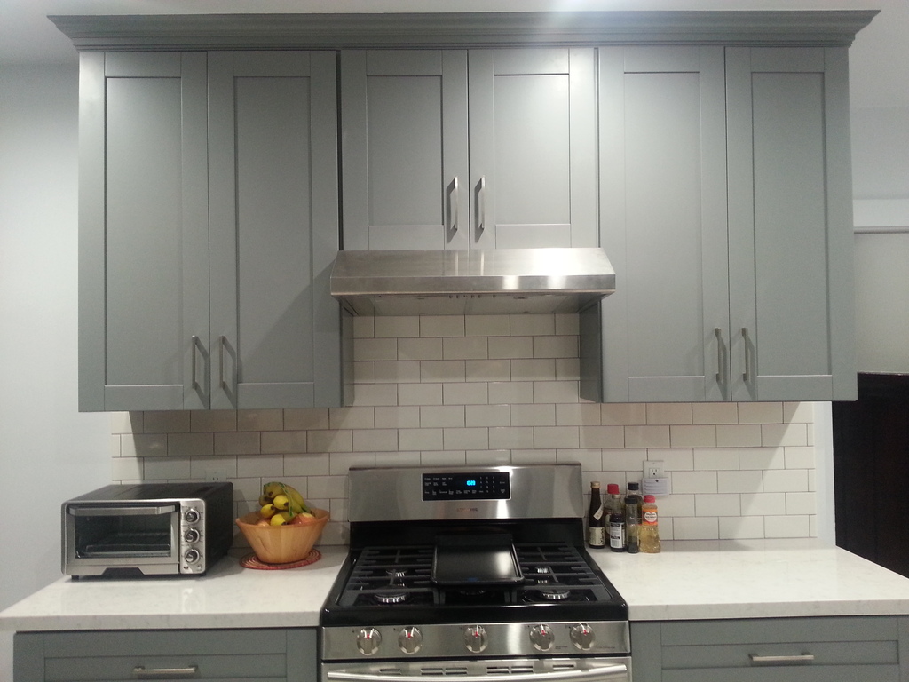 Apartment project satin lacquer finish with island kitchen cabinets