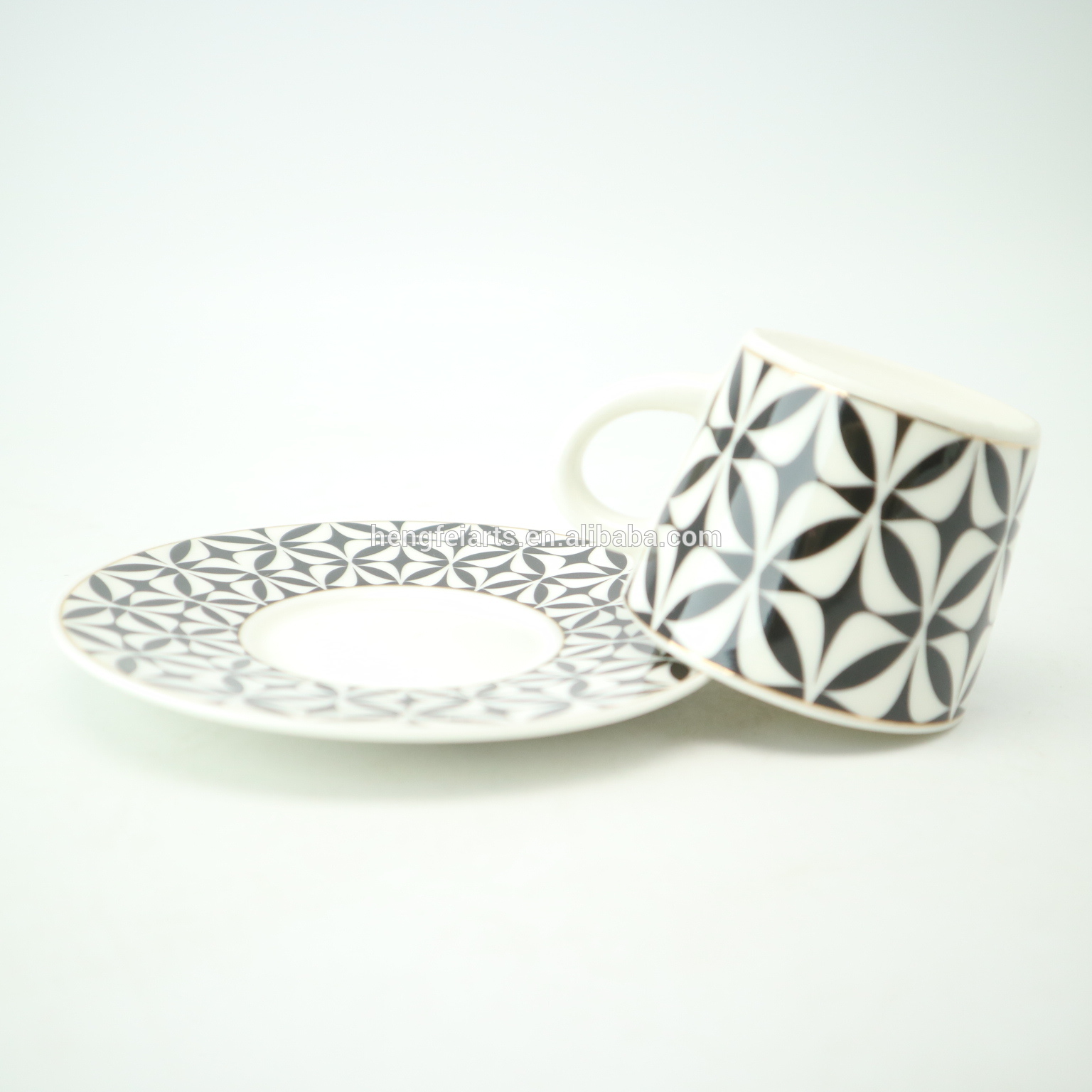 Small ceramic white & black modern design coffee cup with saucer