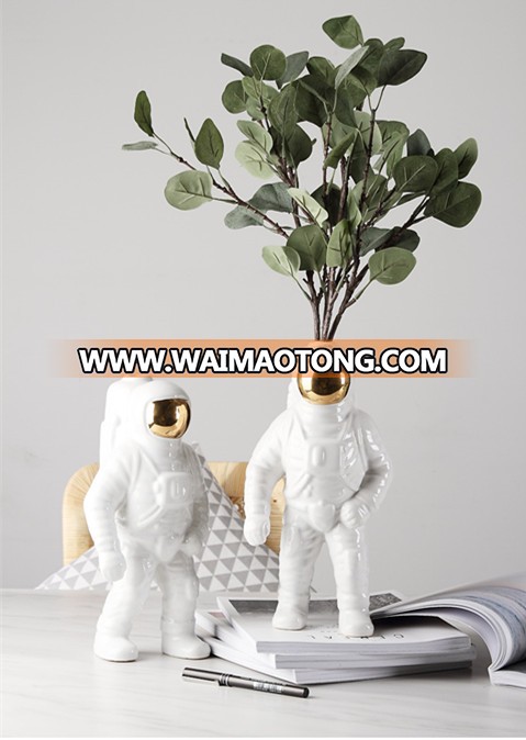 silver and gold plated astronaut model for office table design photos