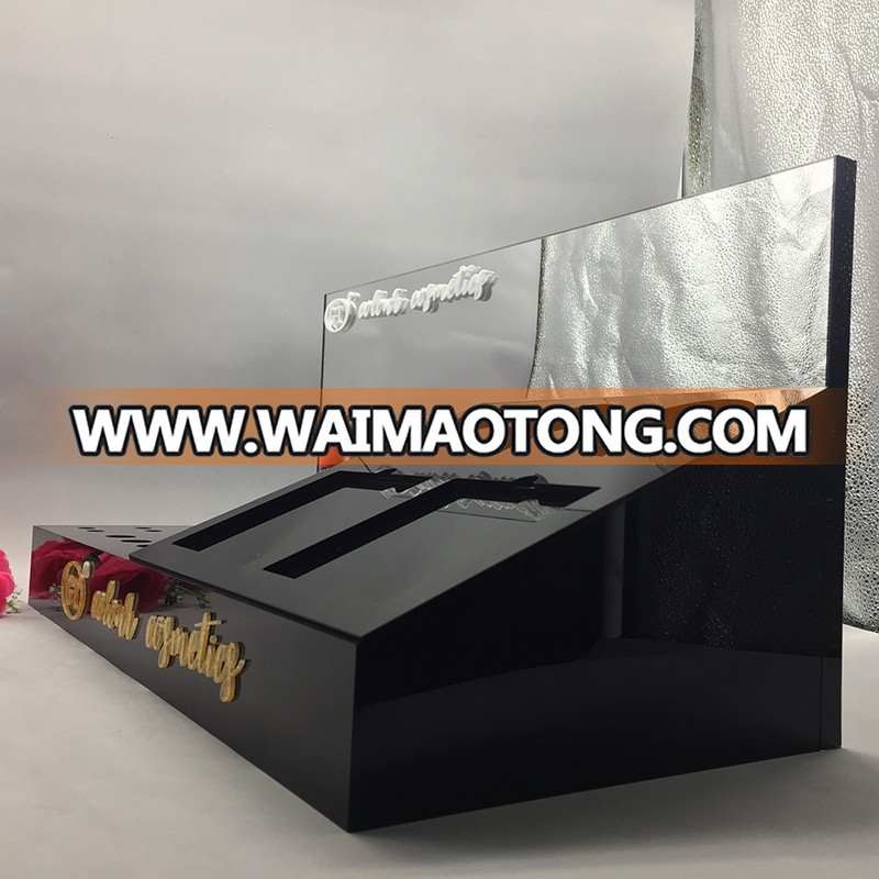 Custom black acrylic cosmetic counter display