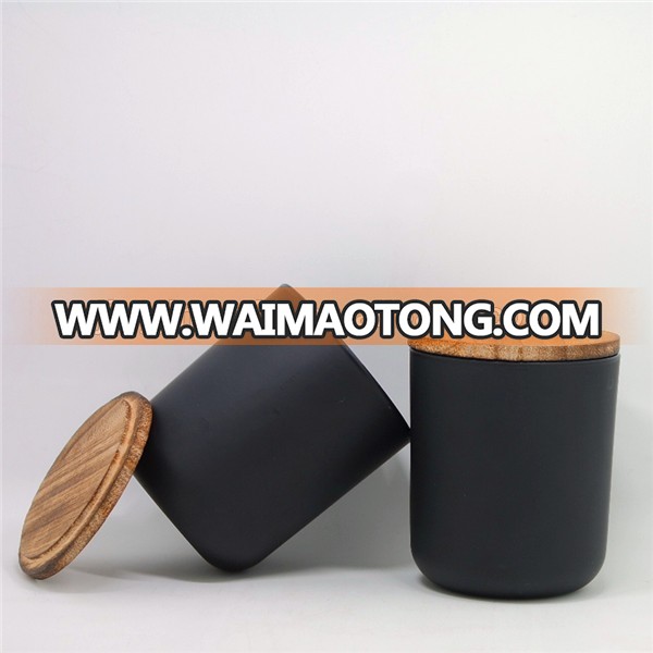 Matte black glass candle holder with smoked wood lid