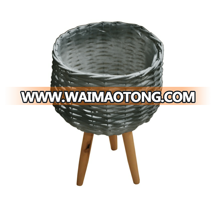 white willow planting pot with wooden feet for green plant