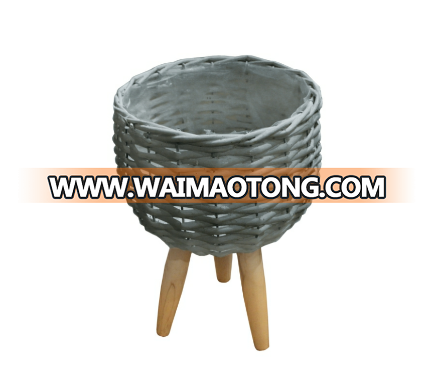 white willow planting pot with wooden feet for green plant