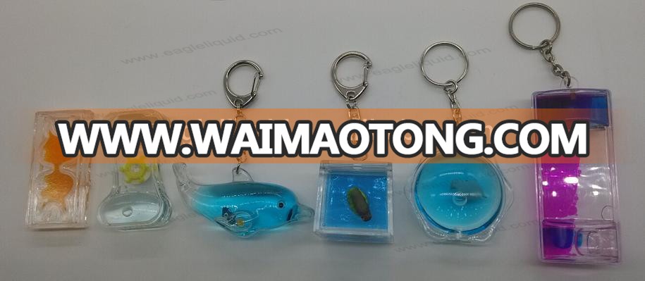 pyramid shape liquid floating keyring aqua keychain with 3D penguin floaters