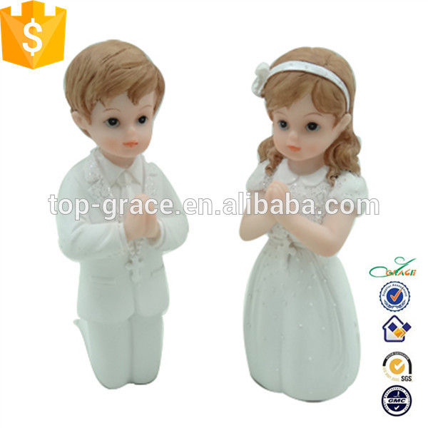 Resin kneeled communion boy and girl