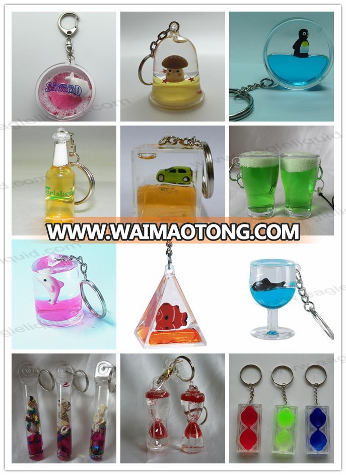 pyramid shape liquid floating keyring aqua keychain with 3D penguin floaters