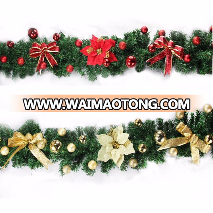 Factory artificial christmas garland with flowers and balls decorated