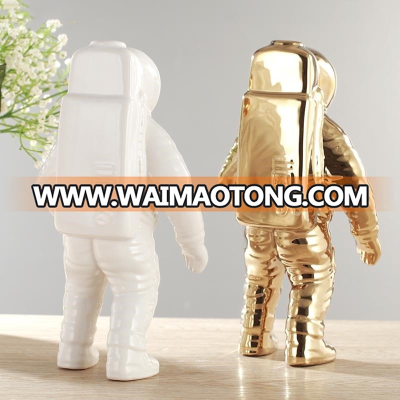 silver and gold plated astronaut model for office table design photos