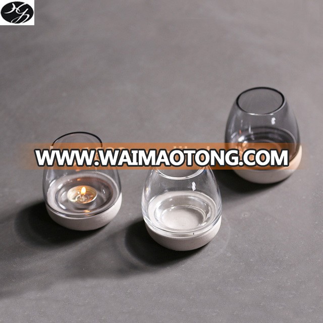 Matte finish cement candle container with glass body