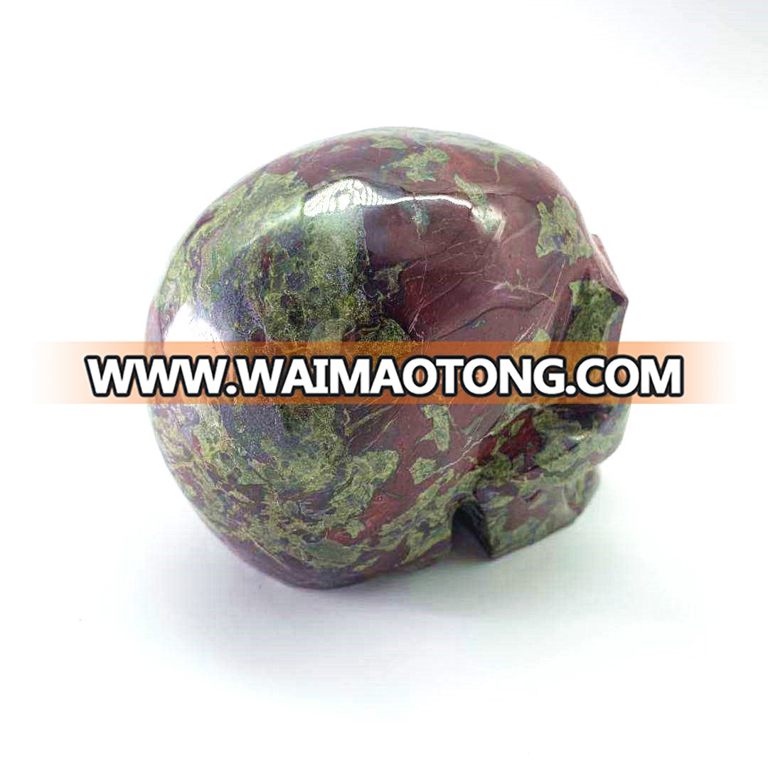 Wholesale natural hand carved crystal dragon blood stone skulls crystal craft skull for decoration