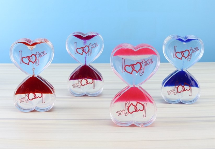 Custom Heart shape Acrylic floating colorful oil and water toys liquid hourglass sand timer