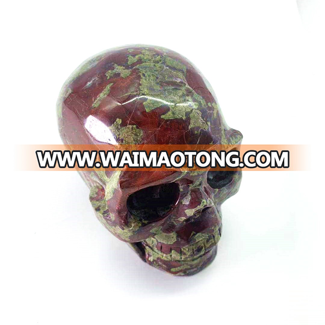 Wholesale natural hand carved crystal dragon blood stone skulls crystal craft skull for decoration