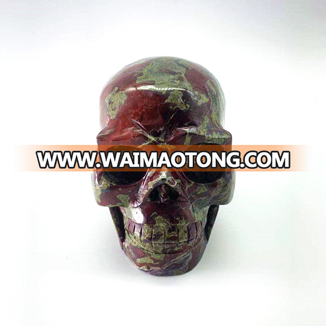 Wholesale natural hand carved crystal dragon blood stone skulls crystal craft skull for decoration