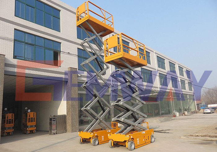 One man operating battery powered self-propelled scissor lift